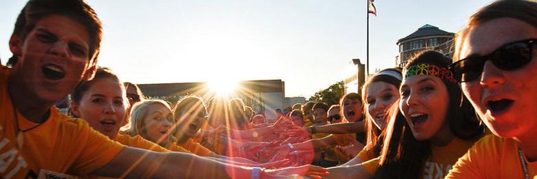 Chapman orientation leaders welcoming new students at sunset